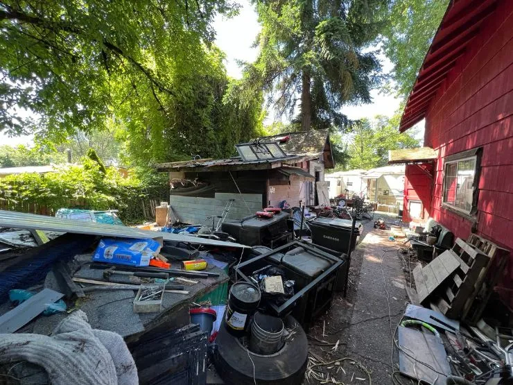 The worn exterior and overgrown yard of an inherited home